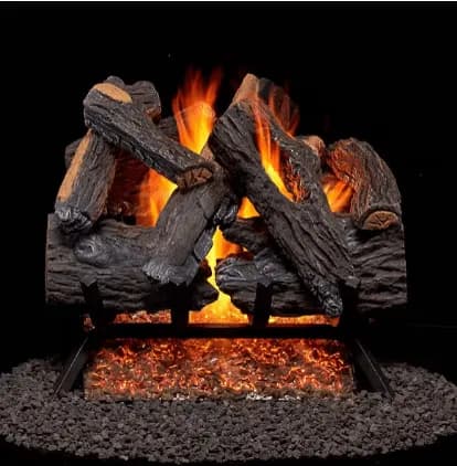 Gas logs burning with bright flames over glowing embers